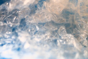 A close-up shot of a plastic bag with crinkled and folded surface