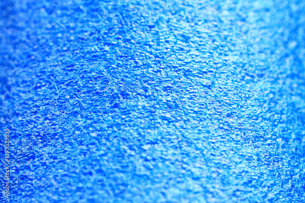 Poster A close-up view of a soft blue towel with a textured surface and frayed edges