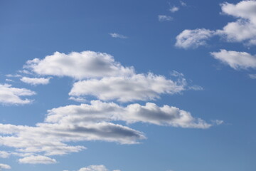 White clouds in a blue bright sky.