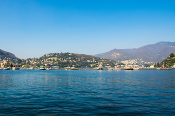Fototapeta premium Tranquil Island View: Serene Waters and Hills in the Distance