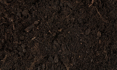 Brown fertile soil for planting as background, top view. Ecology concept. Agriculture and farming...
