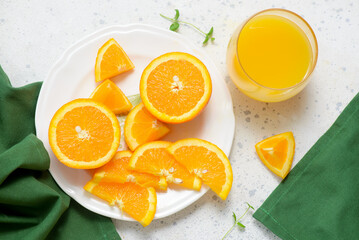 Fresh and juicy sliced  oranges on a plate .selective focus