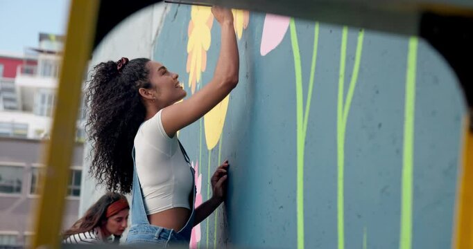 Smile, woman and painting mural on wall with creative decoration, community project and artistic freedom. People, artist and diy with public art, flower design and local culture for outdoor hobby