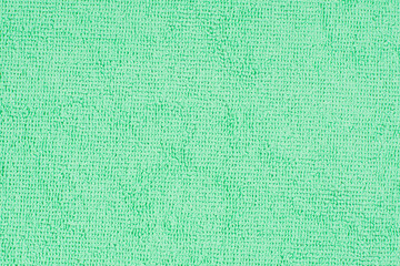 Textured surface microfiber cloth with complex loop pattern, ideal for wiping dust and dirt during delicate cleaning of the house, soft mint color