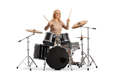 Middle aged woman playing drums