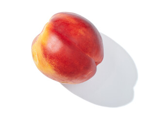 single nectarine on white background
