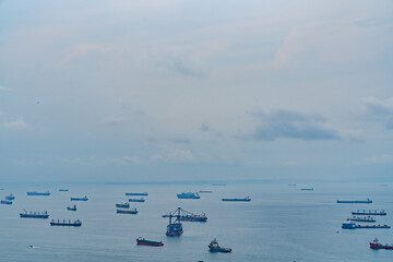 blue sky with clouds aerial view of the Bay with ships in Singapore near Gardens by the Bay