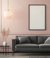 Modern living room with blush pink walls, gray sofa, and empty frame