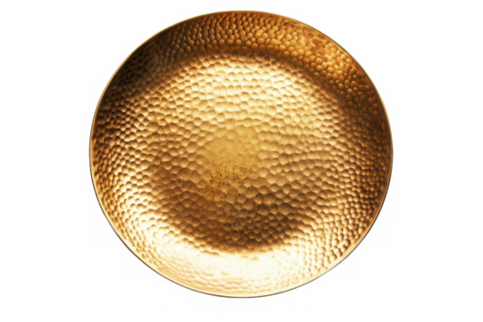 Close up view of a textured golden plate against a plain dark background on transparent background