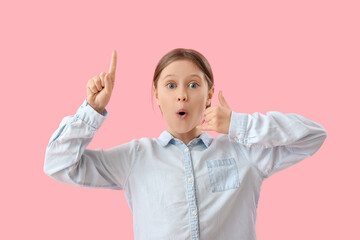 Surprised little girl showing 