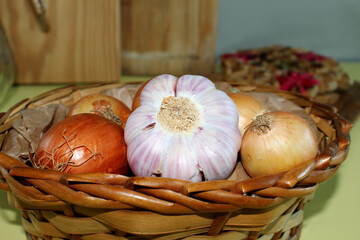 Basket with garlic clove and onions. Brazilian spices.