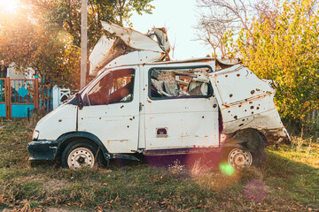 Countryside. Bus damaged by shelling. War in Ukraine