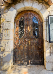 Eze, France - July 9, 2024: Artsy door in historic house
