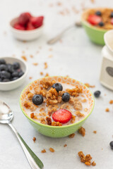 Close Up of Granola in Bowl with Blueberries and Strawberries