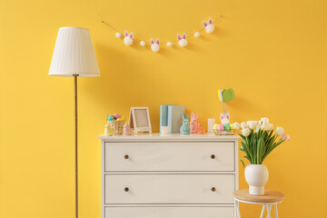 Interior of room with commode, lamp and Easter decor