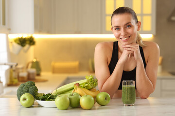 Weight loss. Happy woman with healthy shake at white marble table in kitchen