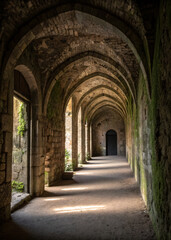 Fototapeta premium Historic Archway Corridor with Soft Lighting and Stone Walls