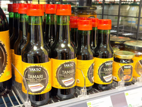 Organic tamari soy sauce bottles on grocery shelf