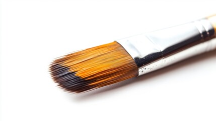 Fototapeta premium Close-up of a paintbrush with natural bristles, showing texture and detail against a white background.