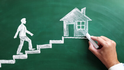 Mortgage concept photo. Hand drawing with white chalk on green school board the stairs and man who is walking on stairs and bearing house on his back.