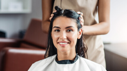 Female happiness. Cheerful young woman enjoying visit to beauty salon, free space
