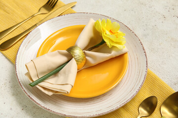 Stylish table setting with golden cutlery and beautiful flower on white background