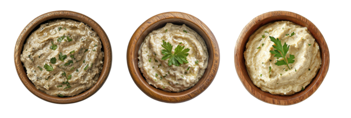 Top view of baba ghanoush in wooden bowls, garnished with parsley, isolated on transparent or white background, traditional Middle Eastern eggplant dip for Mediterranean meals