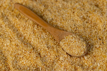 pieces of garlic fruits close up at the table, spices in a spoon