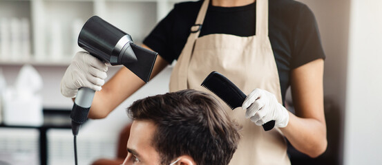 New normal. Young man in medical mask getting hairstyle at barber shop, side view