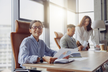 A dedicated team is engaged in a meaningful and productive discussion in a bright, modern office environment