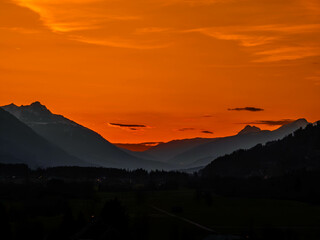 Sunset in the Alps, Silhouettes in the Sunset lights in the Austrian alps