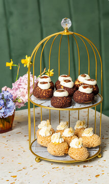 Elegant pastry display with assorted choux puffs on tiered stand