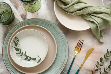 Beautiful table setting with eucalyptus branches on marble background