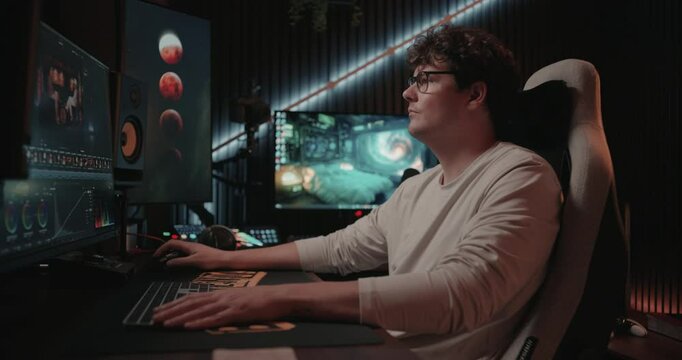 Young man editing a video in his home office 
