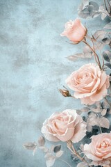 Beautiful pink roses with green stems are displayed on a blue surface
