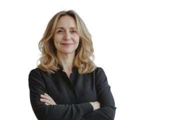 Portrait of 50 years old smiling woman looking at camera with crossed arms. Happy girl standing in creative office. Successful businesswoman standing