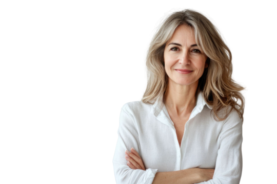 Portrait of 50 years old smiling woman looking at camera with crossed arms. Happy girl standing in creative office. Successful businesswoman standing