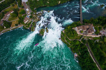 Aerial view of famous Rheinfall and colorful touristic boats in Switzerland
