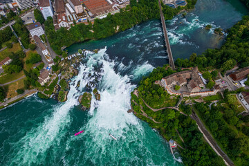 Aerial view of famous Rheinfall and colorful touristic boats in Switzerland