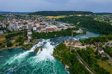 Aerial view of famous Rheinfall and colorful touristic boats in Switzerland