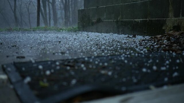 Hail from a thunder storm raining down near residential home