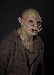 Green Orc Ogr standing with long tusks 