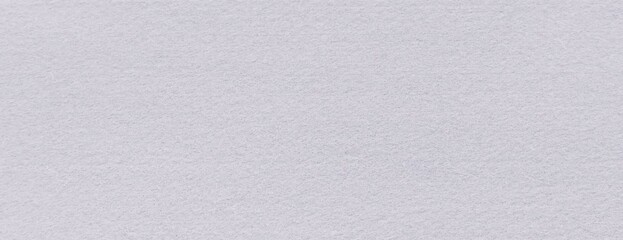 Snow white felt abstract wall fabric background. Surface of fabric texture in white winter color.
