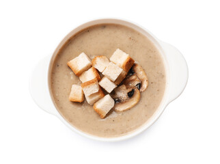 Delicious mushroom cream soup with croutons on white background, top view