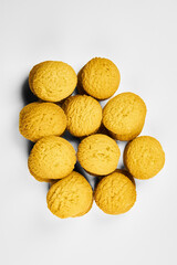 A group of sugar cookies are neatly stacked on top of each other on a white background..Close-up