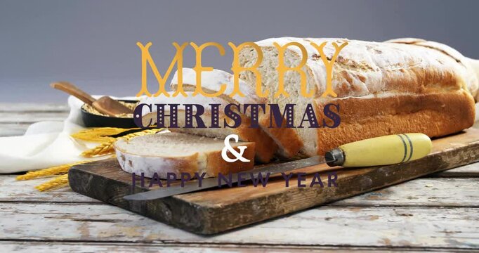 Bread loaf on wooden board with Merry Christmas  and  Happy New Year animation overlay