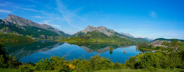 mMountain lake reflection in the reservoir of Riaño
