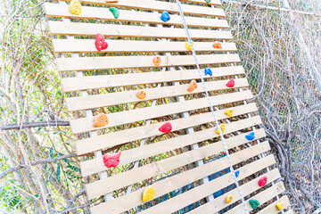 large climbing wall close-up Colorful climbing holds arranged , climbing  gym