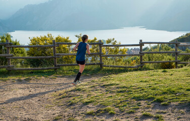 Young female athlete training on the hil
