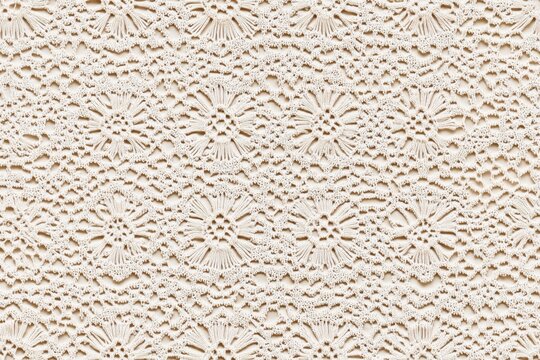 Seamless intricate white crochet Brussels lace pattern with floral motifs.